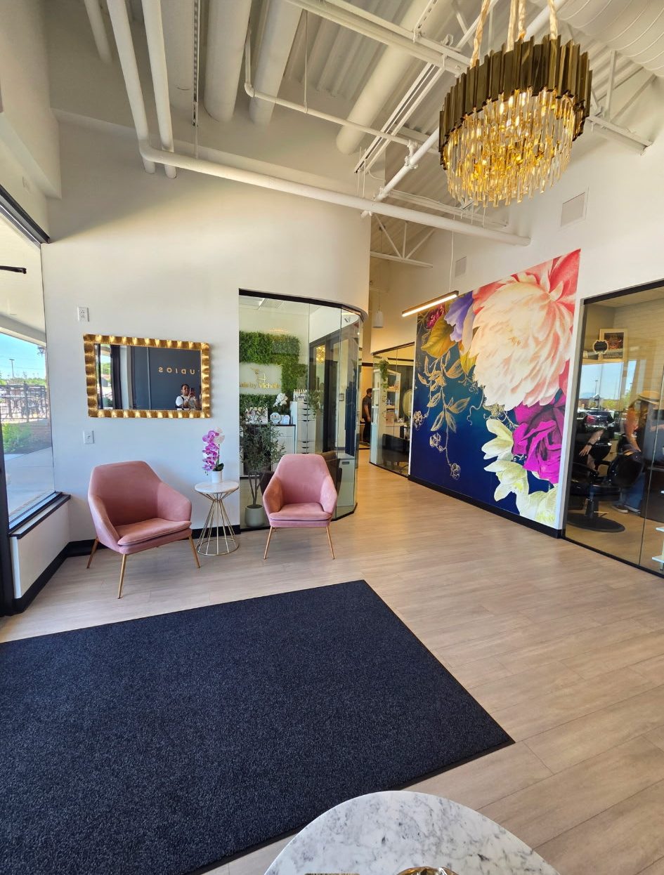 The IMAGE Studios lobby in O'Fallon, with the floral mural and seating by the entrance